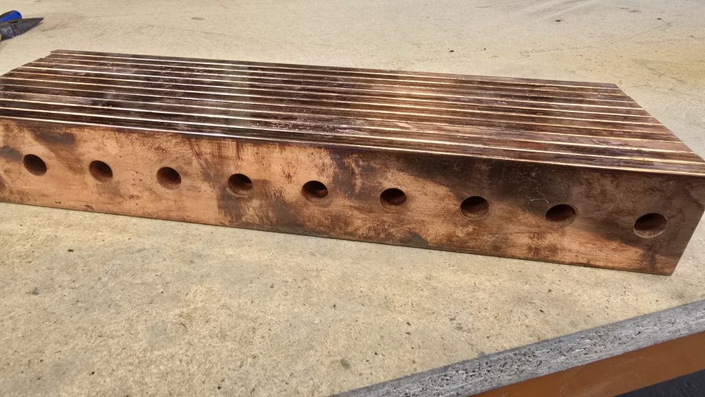 Close view of a thick plate being waterjet cut