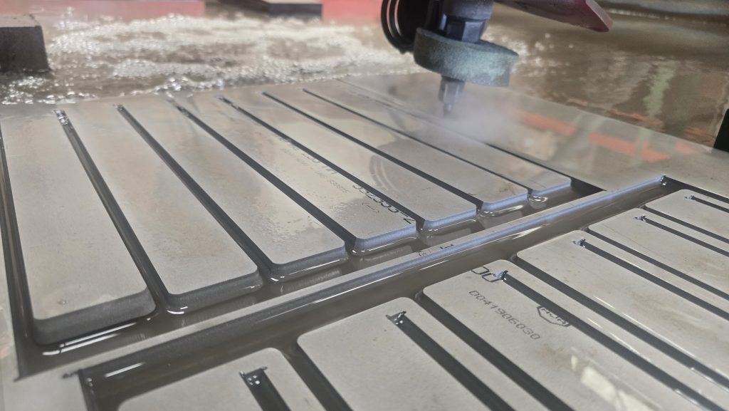 A fresh sheet loaded on the cutting bed